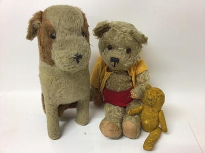 Lot 1826 - Large mohair seated dog with glass eyes, a mohair teddy with plastic eyes and a small mohair bear( missing leg).