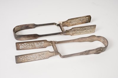 Lot 381 - Two pairs Victorian silver asparagus servers
