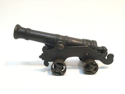 Lot 963 - 19th century bronze signalling cannon on wheeled gun carriage, 26cm in overall length