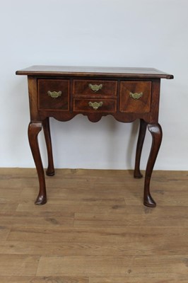 Lot 1400 - Mid 18th century and later walnut lowboy