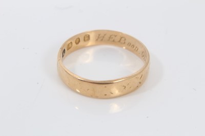 Lot 54 - 18ct gold wedding ring, yellow metal (stamped 585) blue stone signet ring and 9ct gold signet ring with Roman head decoration (3)