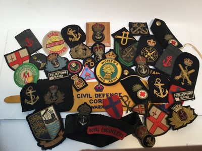 Lot 710 - Collection of Royal Navy and other British military cloth badges including a Civil Defence Corps Warden's arm band (1 box)