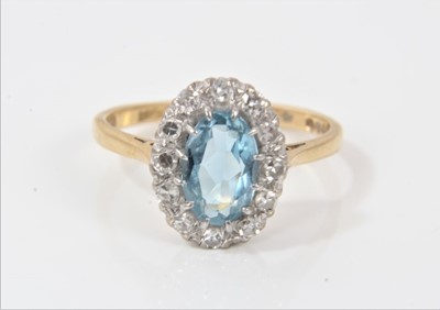 Lot 343 - 18ct gold aquamarine and diamond cluster ring with an oval mixed cut aquamarine surrounded by twelve single cut diamonds