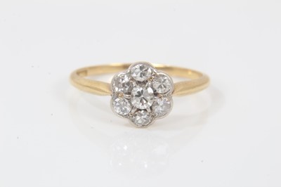 Lot 345 - 18ct gold diamond cluster ring with a flower head cluster of old and single cut diamonds