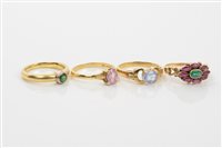 Lot 620 - Group of four gold and gem set dress rings -...