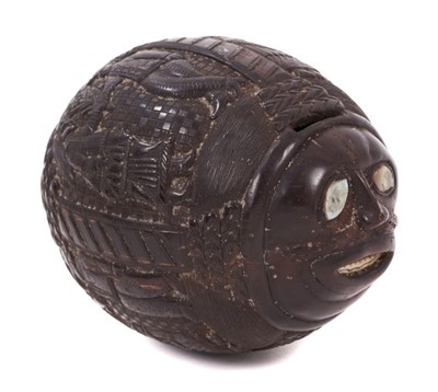 Lot 758 - An 18th / 19th century carved coconut bugbear flask, modelled in relief