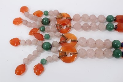 Lot 198 - Two Chinese carved pink hard stone bead necklaces
