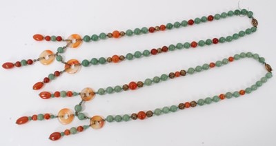 Lot 199 - Two Chinese green jade/hard stone and carnelian bead necklaces