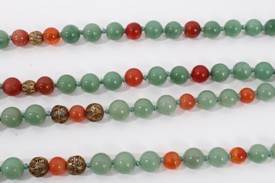 Lot 199 - Two Chinese green jade/hard stone and carnelian bead necklaces