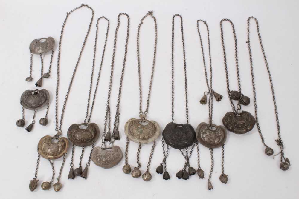 Lot 85 - Collection of nine old Chinese silver/white metal pendant necklaces