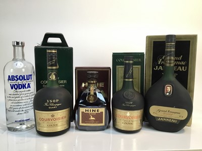 Lot 165 - Cognac - three bottles, Hine V.S.O.P., Courvoisier V.S.O.P (2), a bottle of Grand Armagnac Janneau, each boxed and a bottle of Absolut Vodka (5)