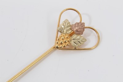 Lot 93 - Three colour gold (stamped 10k) ring with grape vine and leaf decoration and matching stick pin (2)