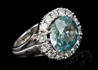 Lot 630 - Aquamarine and diamond cluster ring, the oval...