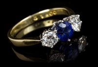 Lot 631 - Sapphire and diamond three stone ring, the...