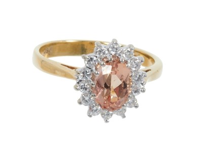 Lot 497 - Brazilian imperial golden topaz and diamond cluster ring in 18ct gold setting