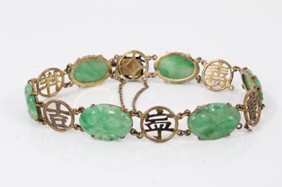 Lot 207 - Chinese jade bracelet with six carved jade oval panels in yellow metal mounts