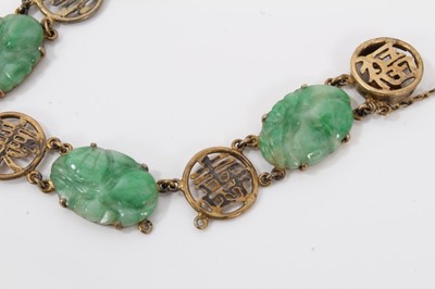 Lot 207 - Chinese jade bracelet with six carved jade oval panels in yellow metal mounts