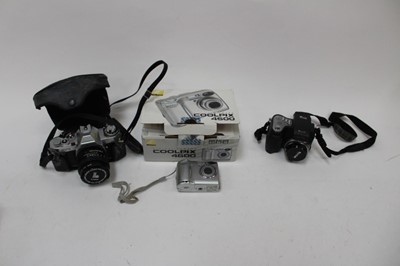 Lot 2458 - Group of cameras and accessories, including a Canon AV-1 and lens