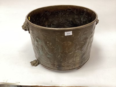 Lot 2625 - Large 19th century brass planter with lion's mask handles, engraved with rampant lions holding a coat of arms, 46.5cm diameter x 34.5cm high