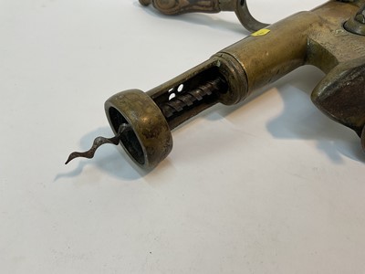 Lot 178 - Antique brass 'Shamrock' bar corkscrew with lever action and turned beech handle, stamped and numbered