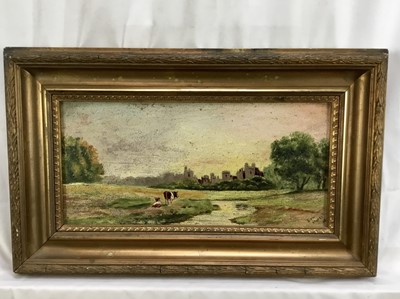 Lot 20 - Late Victorian English School oil on board - cattle before a castle, indistinctly inscribed, 35cm x 16.5cm, in gilt frame