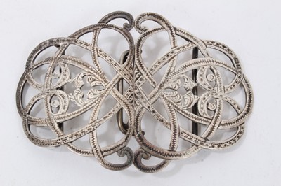 Lot 188 - Three silver nurse’s buckles together with a Victorian silver brooch