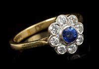 Lot 646 - Sapphire and diamond cluster ring, the...