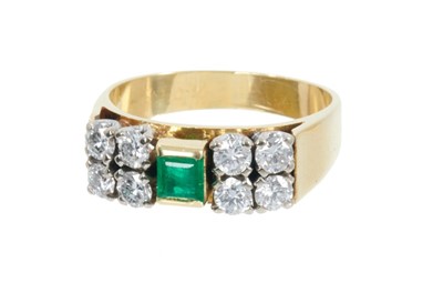 Lot 413 - Emerald and diamond ring with a central step cut emerald and eight brilliant cut diamonds in 18ct yellow gold setting