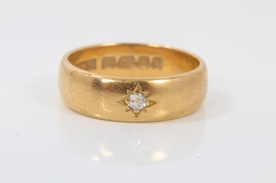 Lot 249 - 22ct gold wedding ring with an old cut diamond in star shape gypsy setting