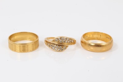 Lot 135 - 22ct gold wedding ring, one other wedding ring and 18ct gold diamond set cross over ring