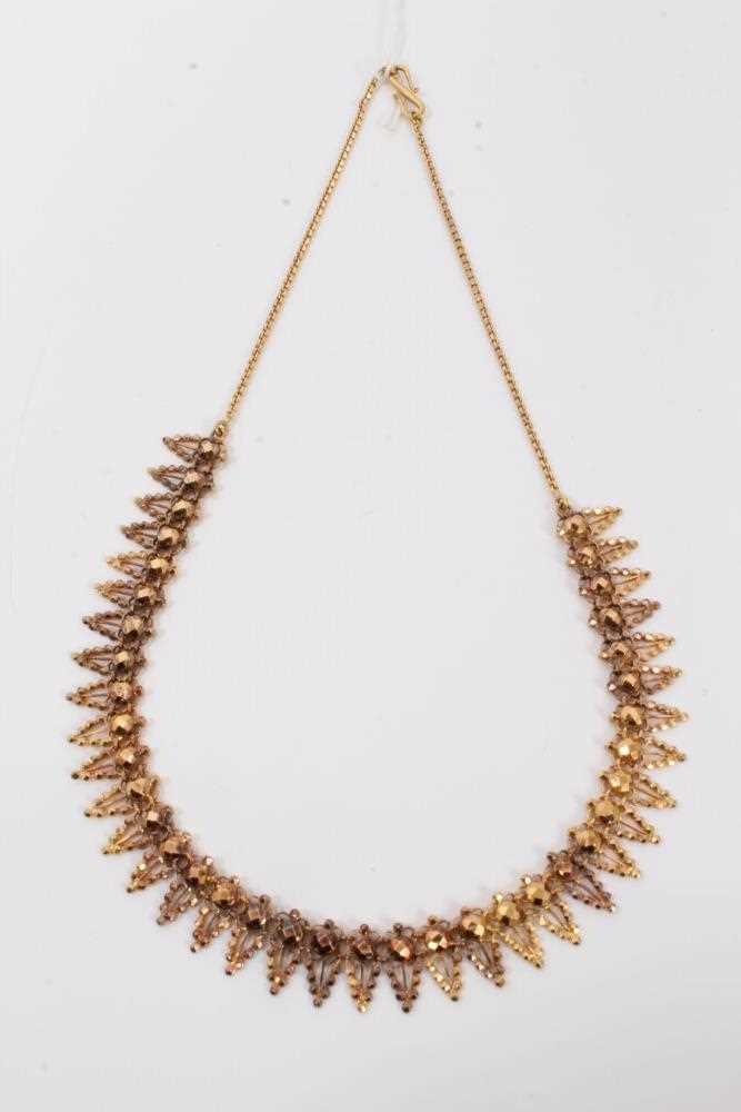 Lot 137 - Indian yellow metal fringe necklace with faceted gold bead decoration
