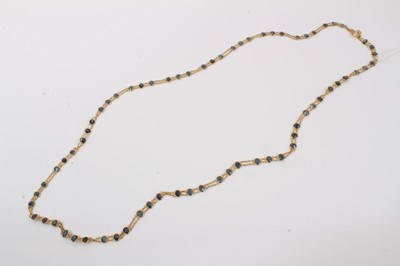 Lot 140 - Indian yellow metal necklace set with blue oval faceted stones