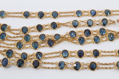 Lot 140 - Indian yellow metal necklace set with blue oval faceted stones