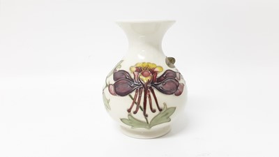 Lot 1225 - Moorcroft pottery vase with floral decoration on cream ground, 13.5cm high, boxed