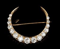 Lot 650 - Victorian diamond crescent brooch with fifteen...