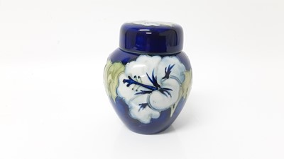 Lot 1232 - Moorcroft pottery ginger jar and cover decorated in the Hibiscus pattern on blue ground, 11cm high