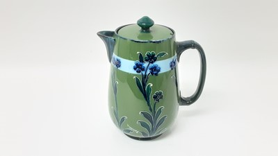 Lot 1234 - Moorcroft MacIntyre chocolate pot decorated in the Forget Me Not pattern, 21cm high