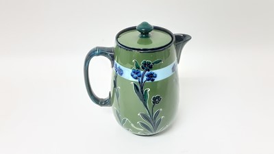 Lot 1234 - Moorcroft MacIntyre chocolate pot decorated in the Forget Me Not pattern, 21cm high