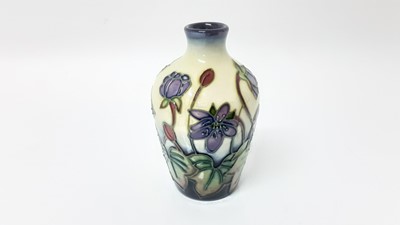 Lot 1236 - Miniature Moorcroft pottery vase decorated with purple flowers, dated 99, 9.5cm high