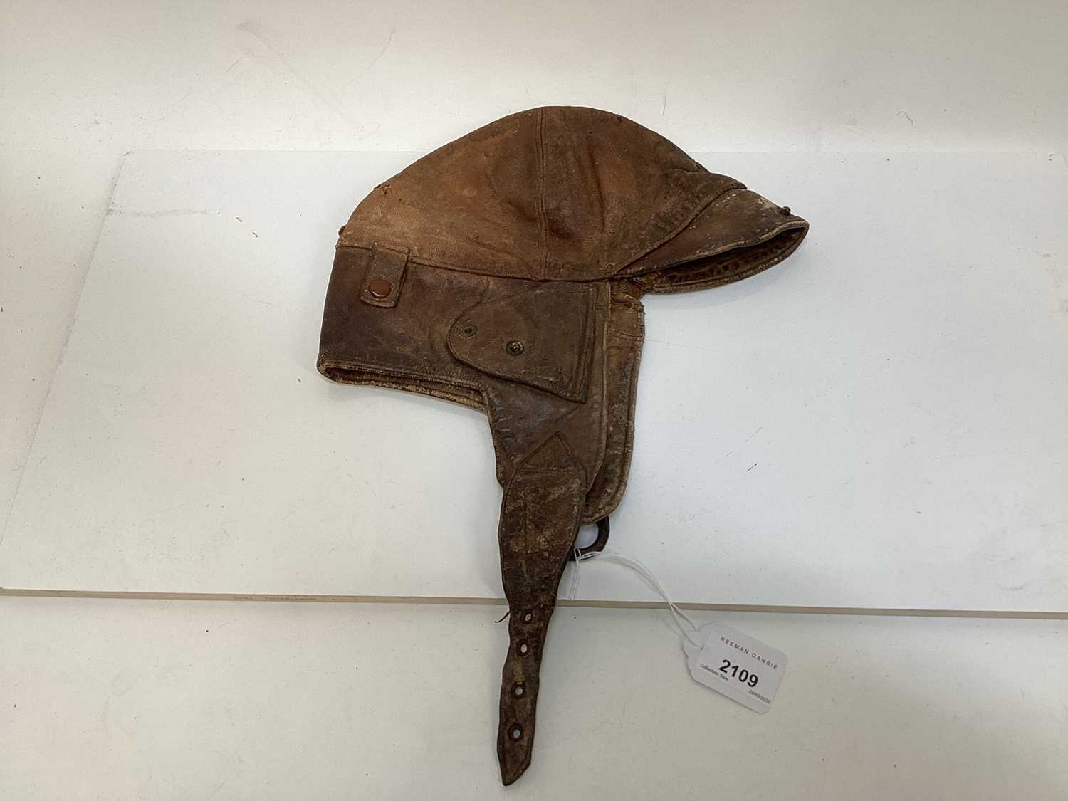 Lot 2109 - Vintage Brown leather flying / motorcycle helmet, with press studs stamped- made in England.