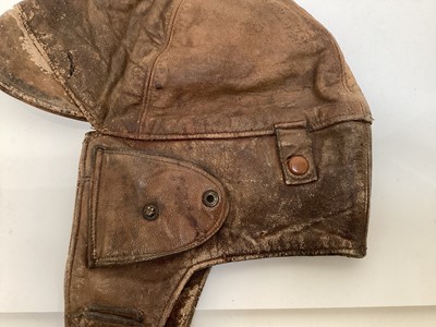 Lot 2109 - Vintage Brown leather flying / motorcycle helmet, with press studs stamped- made in England.