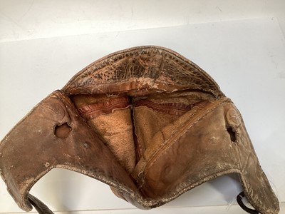 Lot 2109 - Vintage Brown leather flying / motorcycle helmet, with press studs stamped- made in England.