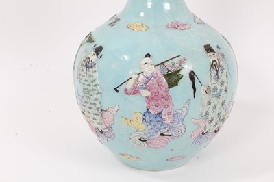 Lot 132 - Chinese polychrome porcelain bottle vase, decorated in relief with the eight immortals, seal mark to base
