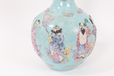 Lot 132 - Chinese polychrome porcelain bottle vase, decorated in relief with the eight immortals, seal mark to base