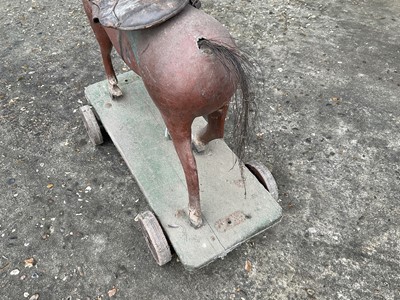 Lot 2 - 19th century child's polychrome painted toy horse, on sledge base and castors, 55cm long