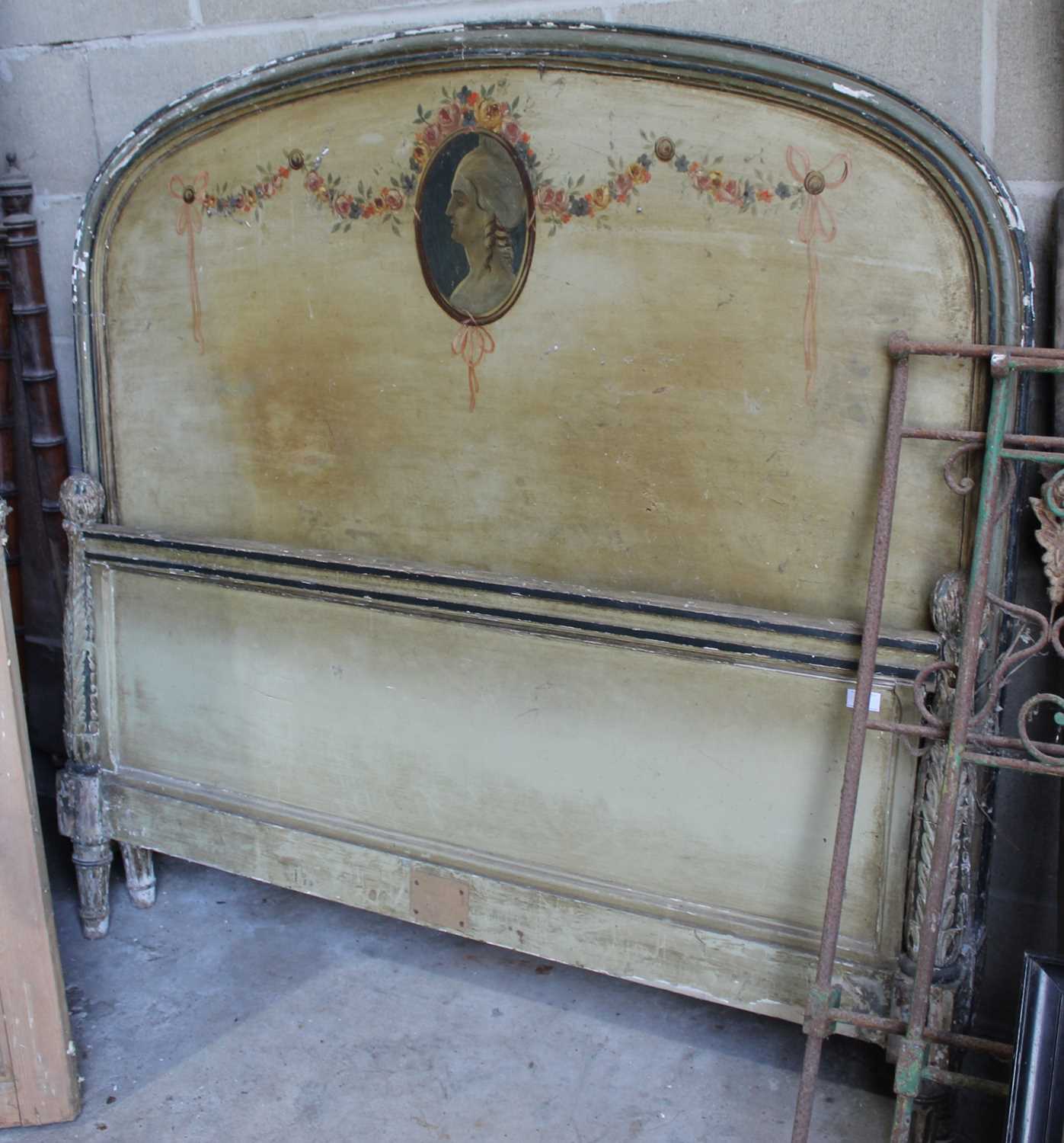 Lot 3 - Late 19th / early 20th century Continental polychrome painted headboard and footboard, painted with 18th century style profile portrait and with ornately carved terminals, 142cm wide