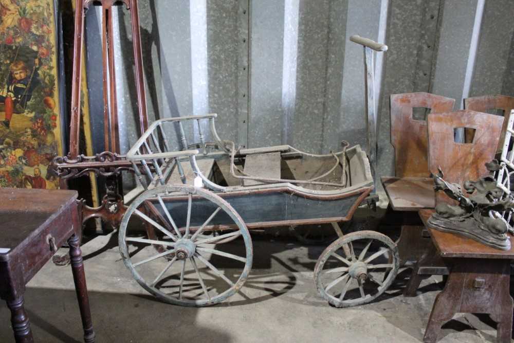 Lot 27 - 19th century childs four wheel buggy, blue painted frame with iron rimmed wooden wheels and folding pull along handle , approx 185 cm overall length