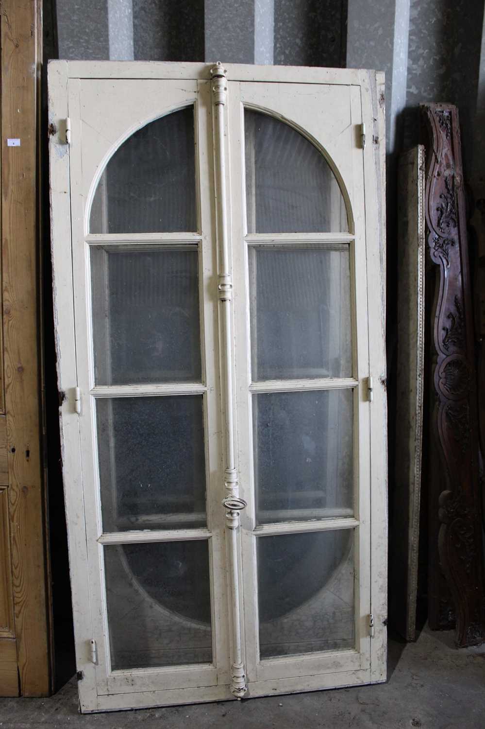 Lot 7 - Set of three antique white painted eight pane arched doors, each with locking bar, 204 x 104cm