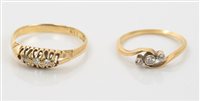 Lot 667 - Diamond three-stone crossover ring and a gold...