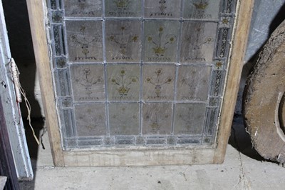 Lot 11 - Large 19th century stained glass panel, the leaded panel with repeat floral motif in gothic borders, approximately 177 x 63cm